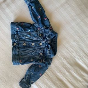Baby gap 6-12 months denim jacket with flowers on it.